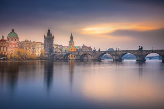 Panoramic view over the cityscape of Prague and Vltava river at dramatic evening, Czech Republic