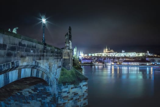 Panoramic view over the cityscape of Prague and Vltava river at dramatic evening, Czech Republic