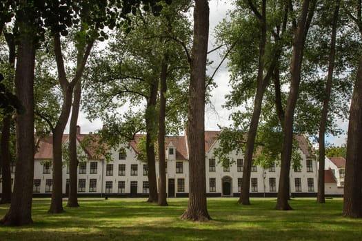 Flemish and ornate architecture of Bruges with garden, Flanders, Belgium