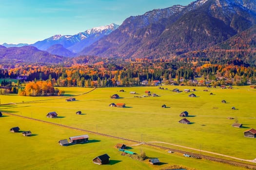 Bavarian alps and rustic farm barns, Garmisch Partenkirchen, Zugspitze massif, Bavaria, Germany