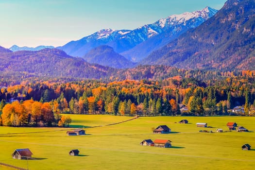 Bavarian alps and rustic farm barns, Garmisch Partenkirchen, Zugspitze massif, Bavaria, Germany