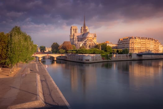 Impressive Notre Dame cathedral in Paris at autumn peaceful sunrise, France