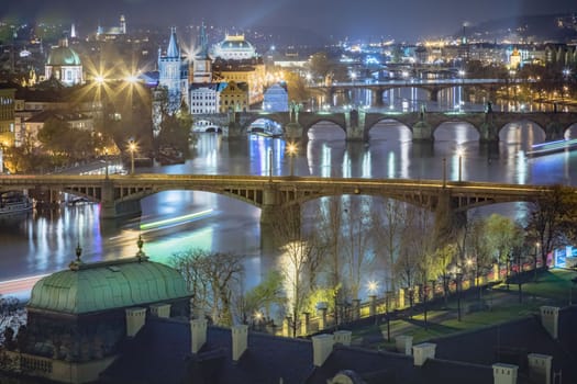 Panoramic view over the cityscape of Prague and Vltava river at dramatic evening, Czech Republic