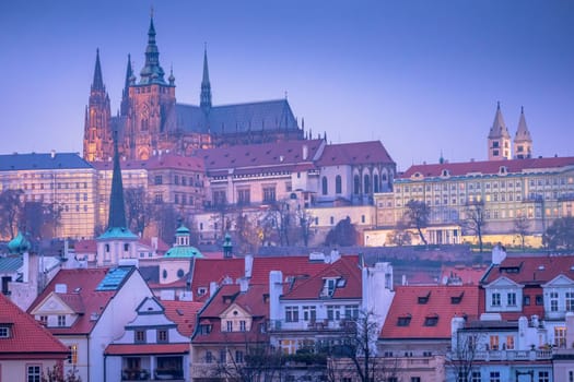 Panoramic view over the cityscape of Prague roofs at dramatic sunset, Czech Republic