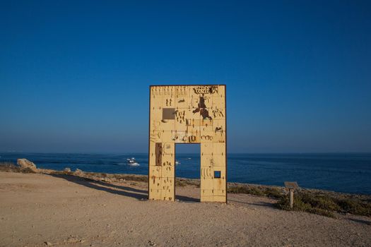 LAMPEDUSA, ITALY - AUGUST, 03: Sculpture of an open door greets the sea realised by the italian artist Mimmo Paladino. It’s called La Porta d’Europa - the door of Europe on August 03, 2018