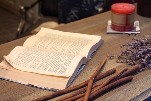 Close up of open book on wooden table