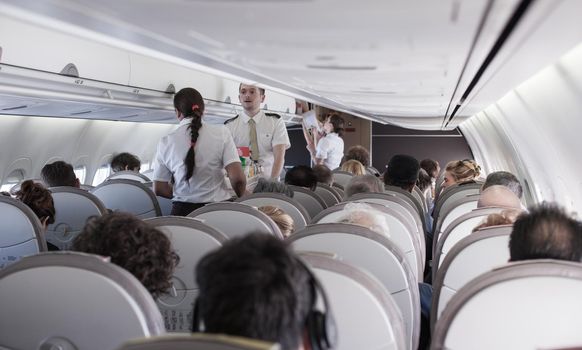 VENEZIA AIRPORT, ITALY - MARCH, 20: Interior of airplane with passengers on seats on March 20, 2016