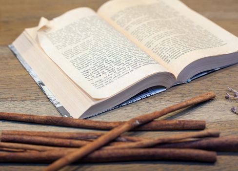 Close up of open book on wooden table