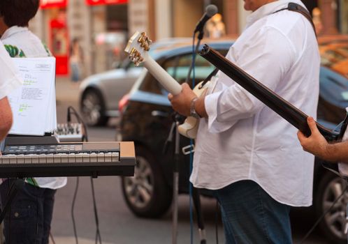 Keyboardist and guitar player during the street concert