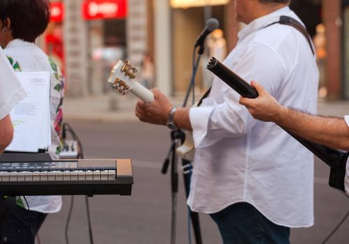 Keyboardist and guitar player during the street concert