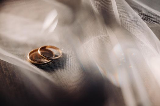 Close-up of two gold wedding rings for a wedding.