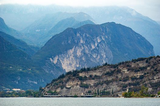 The promenade on Lake Garda and the Alps.Italy.Tuscany.