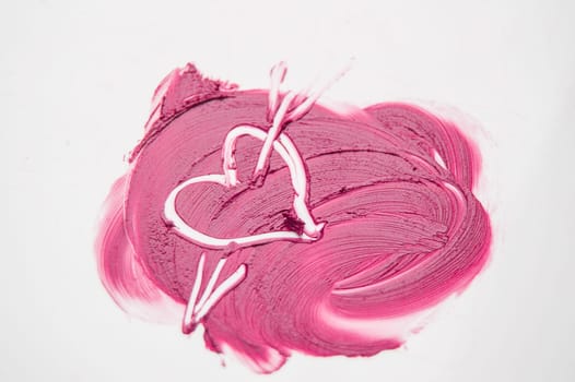 The texture of pink lipstick drawn heart pierced by an arrow, love, cheating, make-up.