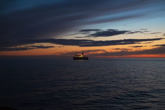 Ferry at sunset Very beautiful orange sky