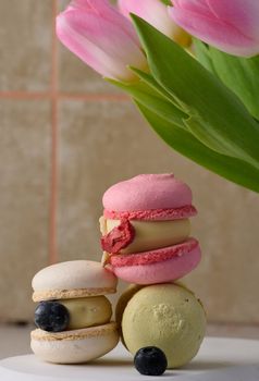 Baked macarons with different flavors on the table, dessert