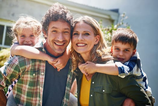 Family is truly the greatest treasure of life. Portrait of a happy family spending time together outdoors