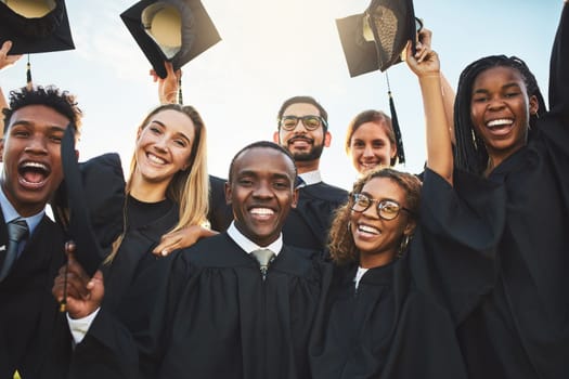 Celebrating a great achievement. a group of cheerful university students on graduation day