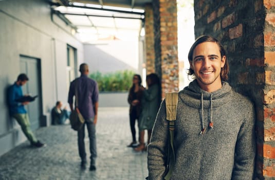 Ready to make a success of the future. Portrait of a happy young man standing outdoors on campus