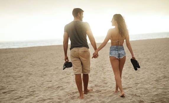 Lets get this vacay started. a young couple spending a romantic day at the beach