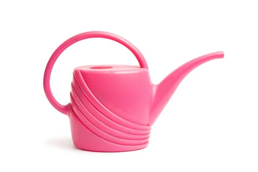 Just plastic pink watering can isolated on white background.