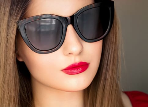 Beauty, fashion and style, face portrait of beautiful woman wearing stylish cat eye sunglasses and red lipstick make-up, luxury accessory and summer lifestyle, glamour and chic look.