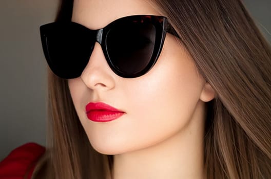 Beauty, fashion and style, face portrait of beautiful woman wearing stylish cat eye sunglasses and red lipstick make-up, luxury accessory and summer lifestyle, glamour and chic look.