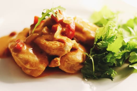 Food and diet, fried chicken fillet with sauce and lettuce as meal for lunch or dinner, tasty recipe idea