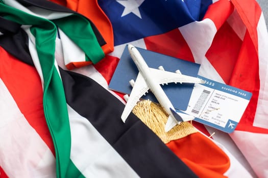 National UAE, USA flags, toy plane and passports.