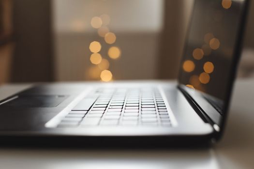 Freelance, working at home office, keyboard close up. Close up of laptop keyboard with blank screen