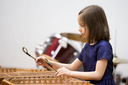 May 21, 2021 Belarus. city of Gomil. Holiday at the music school.The girl plays the ethnic instrument dulcimer