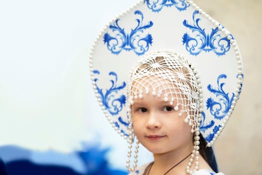 Belarus, city of Gomel, May 21, 2021 Children's holiday in the city. Little girl in Russian national headdress.