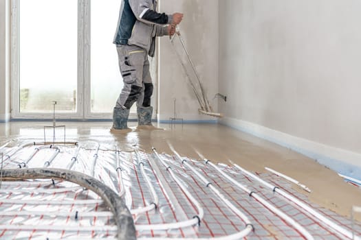 application of concrete on the floor on underfloor heating. 
