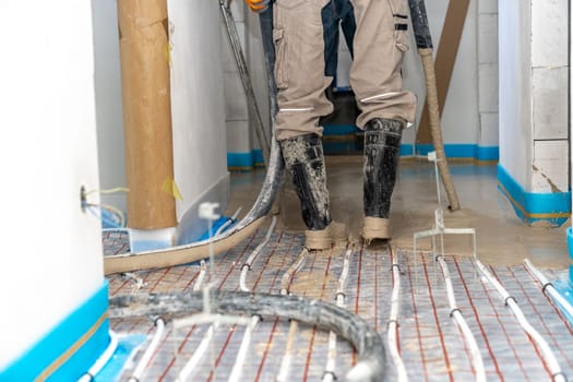 covering the floor heating with anhydride and concrete. High quality photo