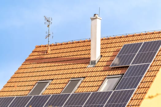 solar panels for the production of electricity from the sun on the roof of a family house. High quality photo