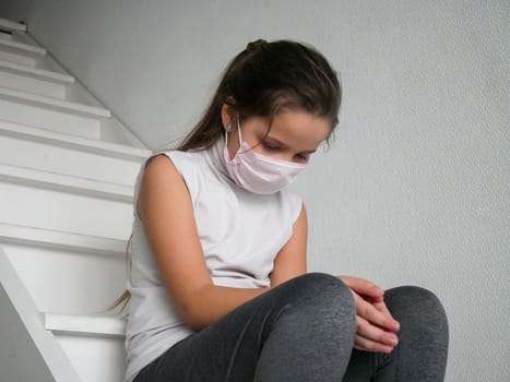 Student girl wearing a mask studying online with an education tutor after COVID quarantine and lockdown, teenage girl student is sad and tired of not going to school with her friends...