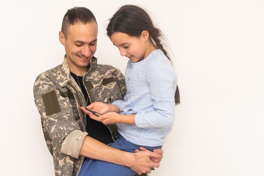 military father hugging his daughter