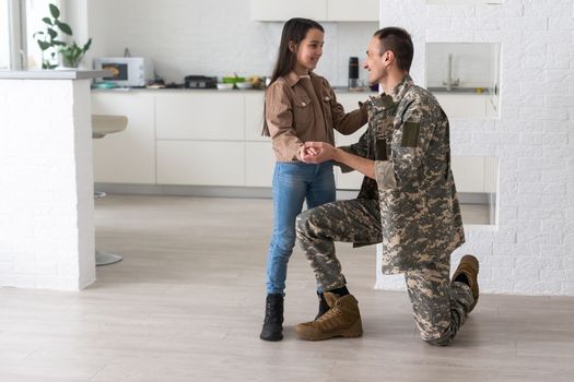 military man and daughter. Family reunion or returning home concept.