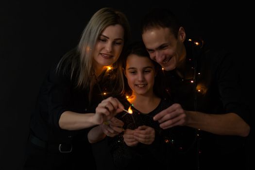 Family portrait on black background