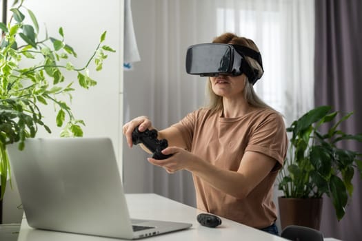 Woman in VR headset looking up at the objects in virtual reality. VR is a computer technology that simulates a physical presence and allows the user to interact with environment.