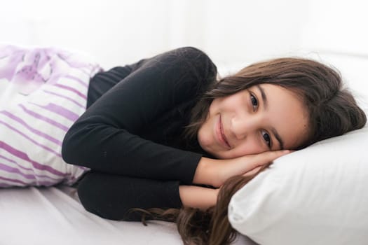 teenage girl in bed. resting, good night sleep concept