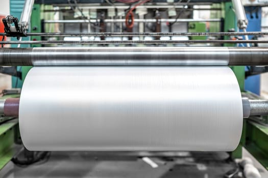 large plastic roll in the factory for the production of plastic packaging material and bags. 