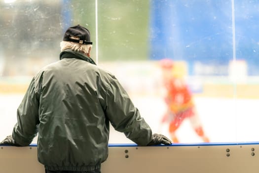 a spectator at a game in a hockey stadium. High quality photo