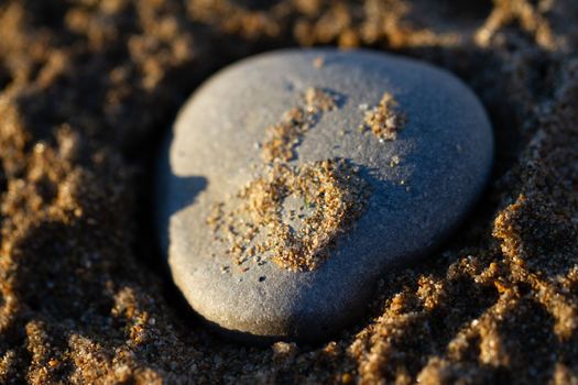 Close up of a rock on a sandy beach. Southampton, Ontario, Canada