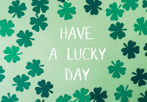 Have A Lucky Day on a green background with clover. Greeting card. High quality photo