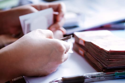 close up image of female hand count the money, business accounting background