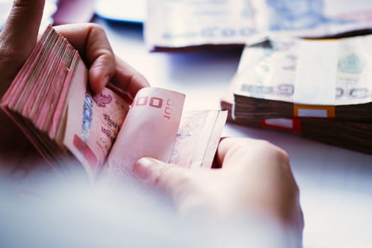 close up image of female hand count the money, business accounting background