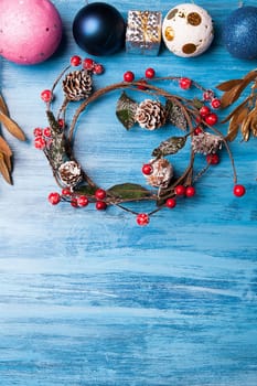 Over head view of christmas gift and decoration over blue wooden background. Merry Christmas
