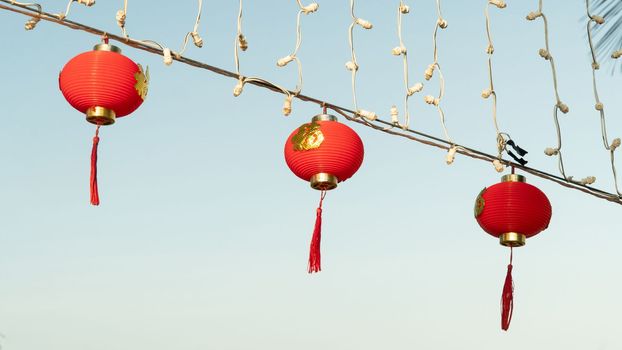 Red Chinese lanterns decoration on the street against the sky. High quality photo