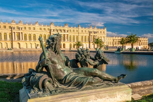 Garden of Chateau de Versailles, near Paris in France at sunset