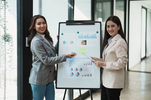 Financial analysts analyzing business reports on planned investment projects during corporate meeting discussions showcase successful teamwork with marketing plan.